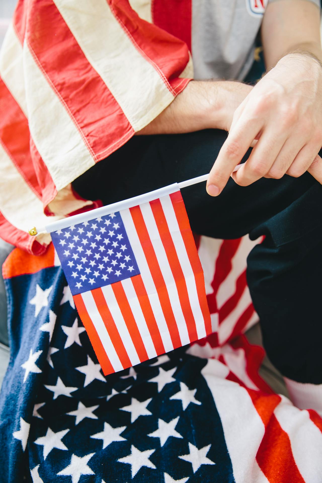 new citizen holding small american flag